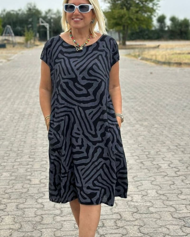 Althea | Flowy midi dress with side pockets